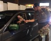 Police handing out flowers to female drivers